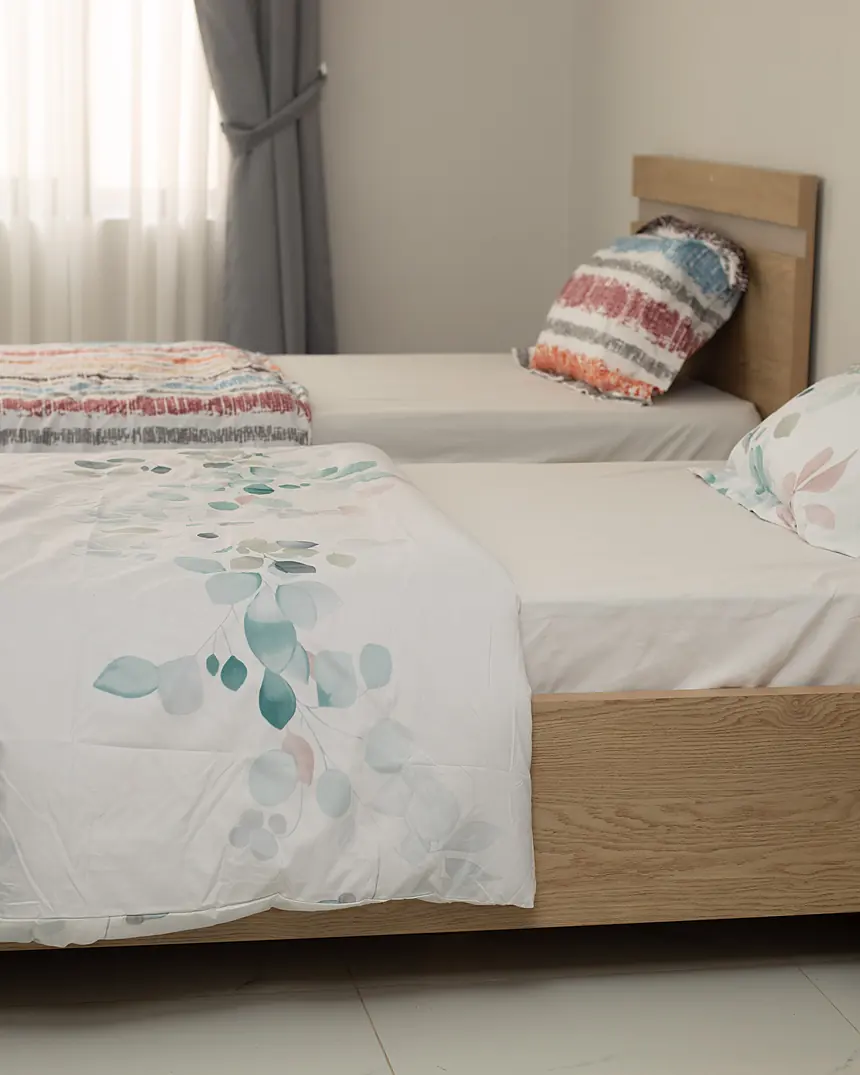 Bedroom with upholstered headboard and soft linen