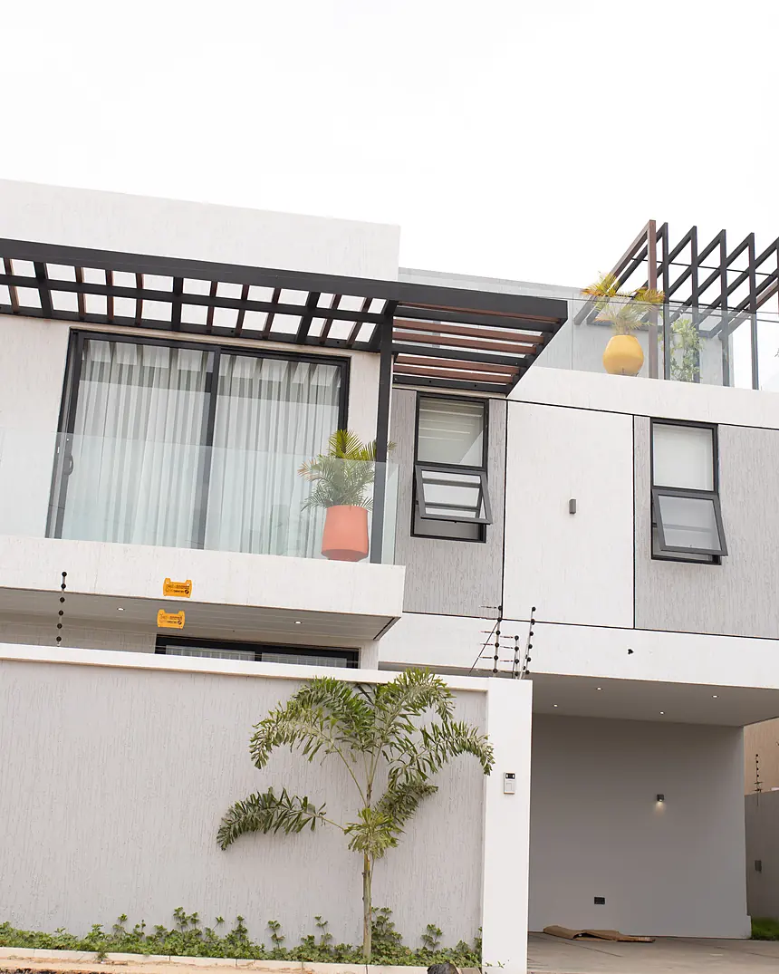 Townhouse facade with balcony and planting